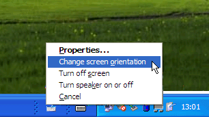 Figure 1-3 Change Tablet And Pen Settings in the notification area gives quick access to commonly used commands.